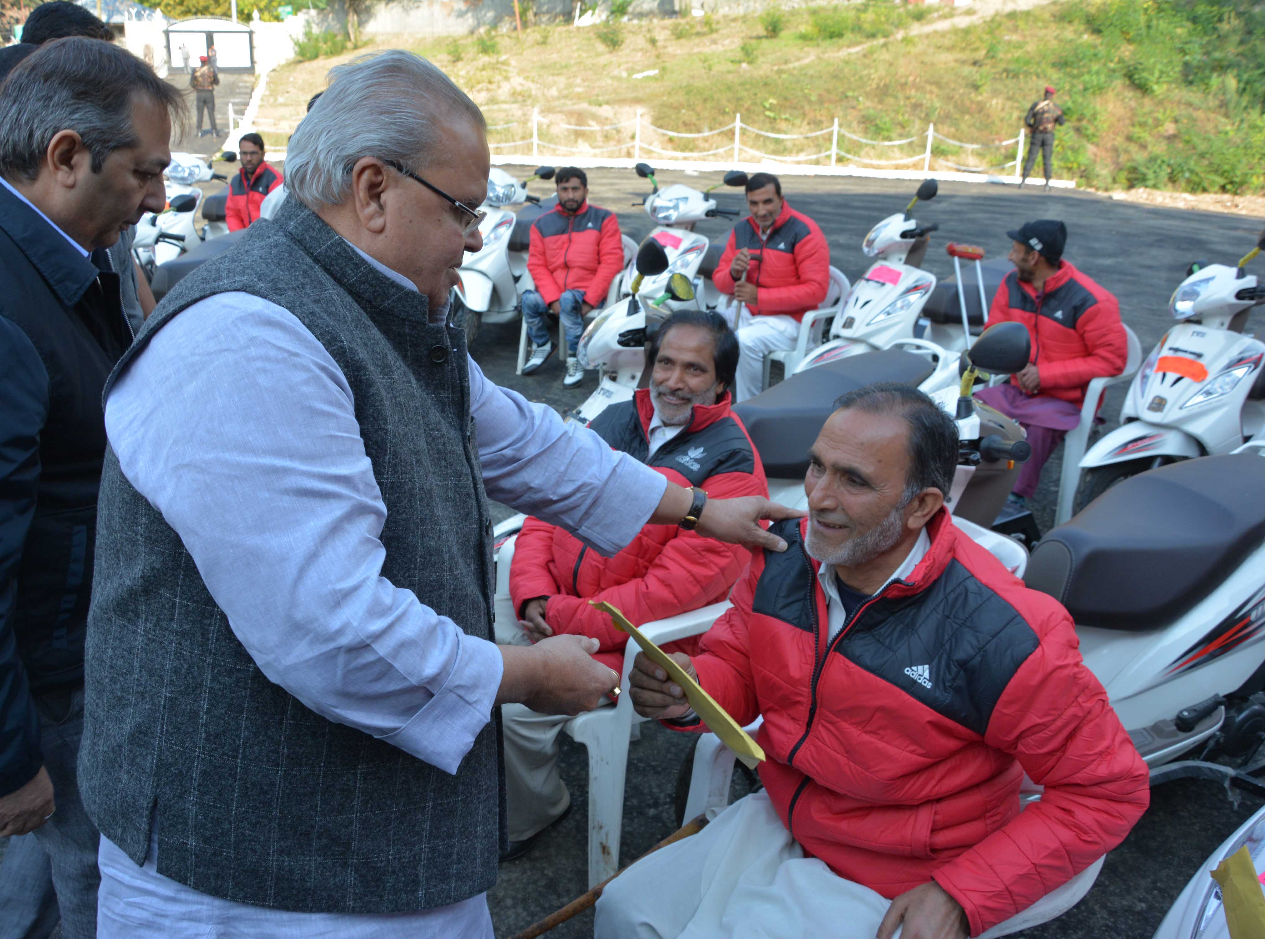 Governor distributes Tri-cycles among physically challenged persons-23.jpg